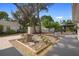 Landscaped backyard featuring a gazebo, storage shed, brick patio, and garden beds at 3005 Garden Rd, Eustis, FL 32726