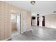 Bedroom with floral wallpaper, laminate flooring, ceiling fan and TV for a cozy and relaxing atmosphere at 3005 Garden Rd, Eustis, FL 32726