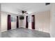 Charming bedroom with floral wallpaper, and new gray laminate flooring at 3005 Garden Rd, Eustis, FL 32726