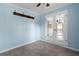 Eat-in-kitchen area with tile floors, blue accent walls, and french doors that lead to another room at 3005 Garden Rd, Eustis, FL 32726