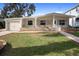Charming house featuring a well-manicured lawn, stone accents and a welcoming front entrance at 3005 Garden Rd, Eustis, FL 32726
