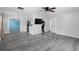 Open-concept living space featuring modern flooring and seamless flow to the kitchen at 3005 Garden Rd, Eustis, FL 32726