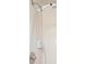 Detail of adjustable shower head and shower accessories at 3005 Garden Rd, Eustis, FL 32726