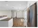 Eat-in kitchen with stainless steel appliances and dark laminate flooring at 303 Puffer Ct, Kissimmee, FL 34759
