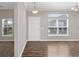 Welcoming living room with abundant natural light, wood floors, and neutral color palette at 303 Puffer Ct, Kissimmee, FL 34759
