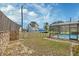 Spacious backyard with an enclosed pool area, fencing, and partial landscaping at 3041 Millstone Ave, Deltona, FL 32738
