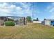 A spacious backyard featuring a screened-in pool, a storage shed, and a well-maintained lawn at 3041 Millstone Ave, Deltona, FL 32738