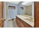 Well-lit bathroom with a shower-tub combo, tile floors, and vanity at 3041 Millstone Ave, Deltona, FL 32738