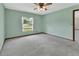 Spacious bedroom with soft carpet and a window offering natural light at 3041 Millstone Ave, Deltona, FL 32738