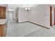 Bright dining area adjacent to the entryway, featuring tile floors and offering a glimpse into the living spaces at 3041 Millstone Ave, Deltona, FL 32738