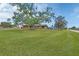 Charming home with a well-manicured lawn and mature trees providing shade and curb appeal at 3041 Millstone Ave, Deltona, FL 32738