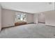 Spacious living room with large bay window and neutral carpet at 3041 Millstone Ave, Deltona, FL 32738
