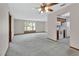 Open living space with a bay window that brings in lots of light and adjoins the kitchen at 3041 Millstone Ave, Deltona, FL 32738