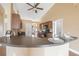 Open-concept kitchen with breakfast bar, wood cabinets, and modern appliances, perfect for entertaining at 307 Mariners Gate Dr, Edgewater, FL 32141