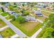 Aerial view of a well-maintained property with lush landscaping at 3104 Umbrella Tree Dr, Edgewater, FL 32141