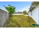 Large fenced backyard with mature tree at 3104 Umbrella Tree Dr, Edgewater, FL 32141