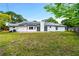 Backyard featuring solar panels and a patio area at 3104 Umbrella Tree Dr, Edgewater, FL 32141