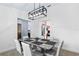 Dining room features a modern chandelier and sleek table at 3104 Umbrella Tree Dr, Edgewater, FL 32141