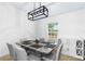 Bright dining room with modern lighting and stylish buffet at 3104 Umbrella Tree Dr, Edgewater, FL 32141