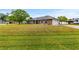 Spacious corner lot home with a brick facade, two car garage, and green lawn at 3104 Umbrella Tree Dr, Edgewater, FL 32141