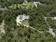 Private home with pool nestled among mature trees on a large lot, providing seclusion at 3211 Hidden Crest Ln, Deland, FL 32724