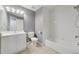 Bathroom featuring a vanity with sink, toilet, and a shower-tub combo at 3211 Hidden Crest Ln, Deland, FL 32724