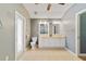 Well-lit bathroom with double sinks, a vanity, and tile flooring at 3211 Hidden Crest Ln, Deland, FL 32724