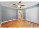 Bedroom with spacious closet, wood-look flooring, and natural light at 3211 Hidden Crest Ln, Deland, FL 32724