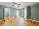Bright bedroom with a window view, a closet, and wood-look flooring at 3211 Hidden Crest Ln, Deland, FL 32724