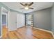 Bedroom featuring a closet, bright window, and wood-look flooring at 3211 Hidden Crest Ln, Deland, FL 32724