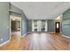 Open living space with large windows allowing natural light and dark brown entry door at 3211 Hidden Crest Ln, Deland, FL 32724