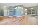 Open living space with large windows allowing natural light and light brown wood flooring at 3211 Hidden Crest Ln, Deland, FL 32724