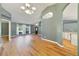 Spacious living space with large windows allowing natural light and view of kitchen at 3211 Hidden Crest Ln, Deland, FL 32724
