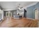 Spacious room with hardwood floors and great light, adjacent to an open kitchen at 3211 Hidden Crest Ln, Deland, FL 32724