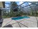 Backyard screened-in pool, lush greenery and outdoor seating area at 3211 Hidden Crest Ln, Deland, FL 32724