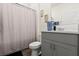 Well-lit bathroom with a gray vanity, modern fixtures, and neutral decor at 322 E Merimont Ln, Ormond Beach, FL 32174