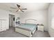 Comfortable bedroom with plush carpeting, ceiling fan, and a queen-sized bed at 322 E Merimont Ln, Ormond Beach, FL 32174