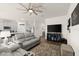 View of the living room, including an open kitchen concept and media center at 322 E Merimont Ln, Ormond Beach, FL 32174