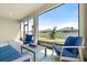 Comfortable screened patio with outdoor seating, perfect for relaxation and enjoying the backyard view at 322 E Merimont Ln, Ormond Beach, FL 32174