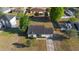 Aerial view of a single-story home with a fenced backyard and mature trees at 3237 Cranston St, Deltona, FL 32738