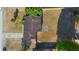 Aerial view of a home with a long driveway, fenced-in yard, and mature trees at 3237 Cranston St, Deltona, FL 32738