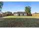 Large fenced backyard with a sliding glass door leading into the house at 3237 Cranston St, Deltona, FL 32738