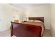 Comfortable bedroom with neutral walls, a view of the bathroom and fenced-in backyard at 3237 Cranston St, Deltona, FL 32738