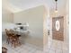 Inviting entryway with tile floors leading to a kitchen bar area featuring two bar stools at 3237 Cranston St, Deltona, FL 32738