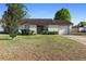 Charming single Gathering home featuring a well-maintained lawn and attached one car garage at 3237 Cranston St, Deltona, FL 32738