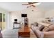 Bright living room with vaulted ceilings, a ceiling fan, and sliding glass doors leading to backyard at 3237 Cranston St, Deltona, FL 32738