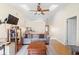 Bright living room featuring light-colored walls and vaulted ceilings with skylight at 3237 Cranston St, Deltona, FL 32738