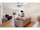 Bright living room with vaulted ceilings, a ceiling fan, and sliding glass doors leading to backyard at 3237 Cranston St, Deltona, FL 32738