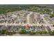 Expansive aerial view of a residential community featuring well-maintained homes and tree-lined streets at 3845 Arborvitae Way, Deland, FL 32724