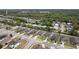 Neighborhood aerial view of modern homes with driveways, landscaping, and solar panels under a sunny sky at 3845 Arborvitae Way, Deland, FL 32724